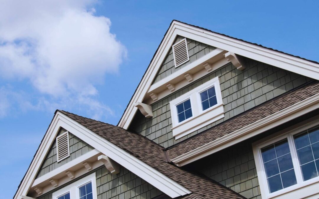 Modern Suburban House, gray, double peaking roof. clear sky day roof construction