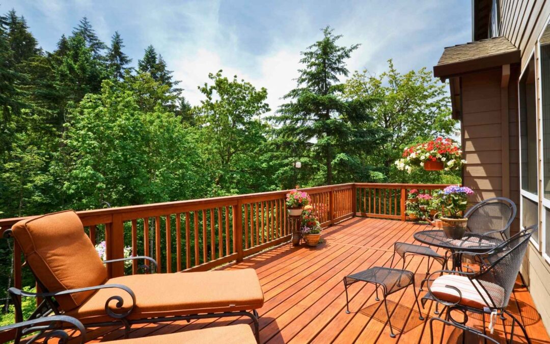 forested home with modern deck material comparison with flowers furniture and space